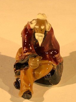 Miniature Ceramic Figurine Man Sitting On Bench 2"